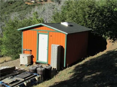 Storage shed with skylight.