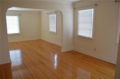 Dining room with oak wood floors and archways