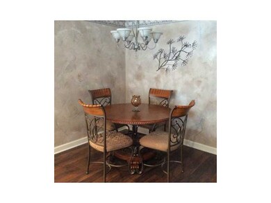 Dining Room. New plank laminate has look of hardwo
