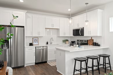 All stainless steel appliances included. photos of similar model and not of actual home.