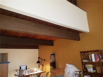 Exposed beams and wood give this townhome characte