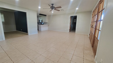 The family room is large and open to the kitchen b