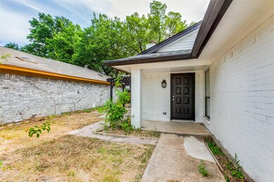 Entrance to property featuring covered porch