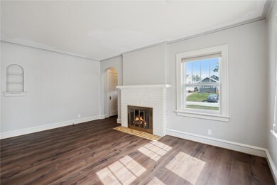 LR wood burning fireplace, LVP flooring
