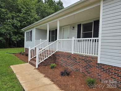 Front entry sidewalk and new shrubs