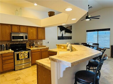 Kitchen featuring stainless steel appliances, tast