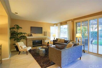 Comfortable family room with fireplace and slider 