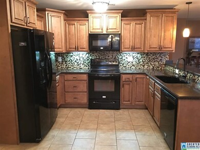 Maple Rope Trim Cabinets, Mosaic Tile Backsplash, 