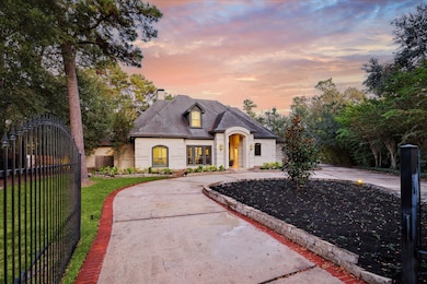 Gated circular driveway adds to the privacy of thi