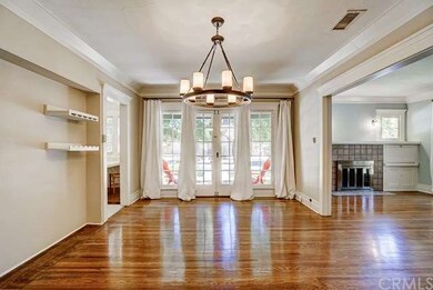 Formal dining room with French doors leading to qu