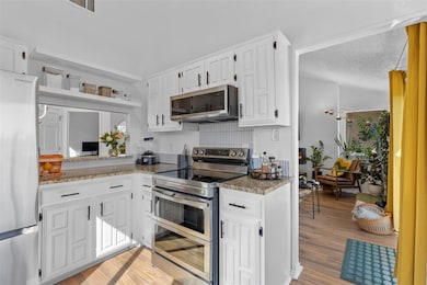 Kitchen featuring appliances with stainless steel 