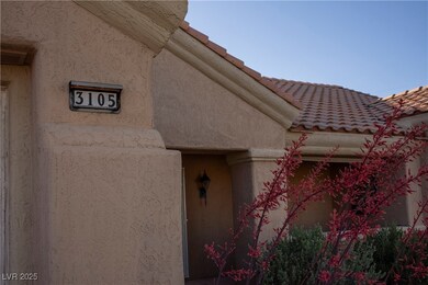 View of exterior entry featuring a tile roof and s