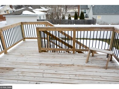 Spacious deck overlooks fenced-in private backyard