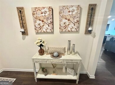 Interior details featuring baseboards and wood finished floors