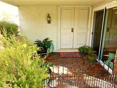 Front patio and double front door entry.