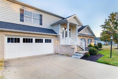 View of front of property with a garage and a fron