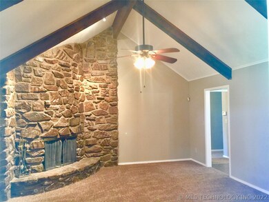 Family with new carpet beautiful Rock fireplace an