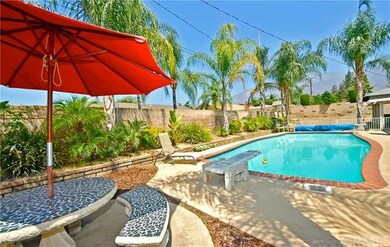 Beautiful backyard with a mountain view, pool, cov