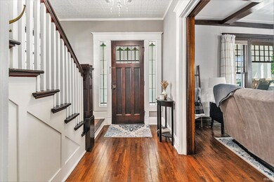 Beautiful Hardwood Floors and Open Wooden Staircas