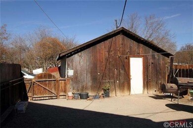 Back yard over looking converted garage