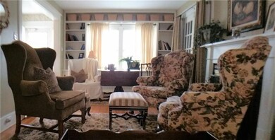 Living Room features custom shelving around the la