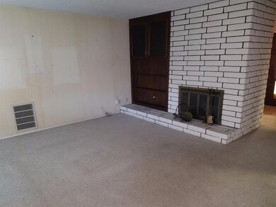 The brick fireplace in the central area