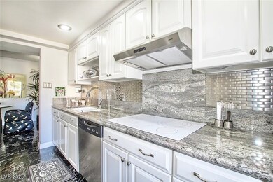 Kitchen with stainless steel dishwasher, under cab