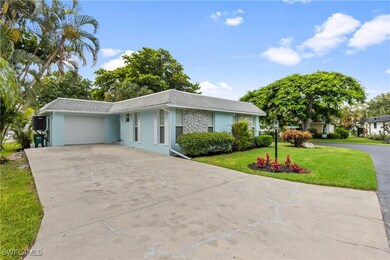Single story home featuring a garage and a front l