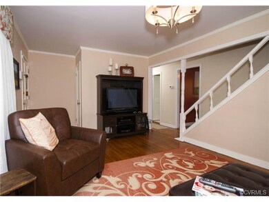 Another view of the living room, showing exposed s