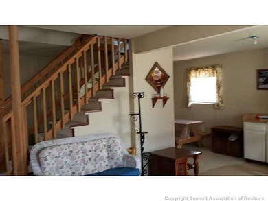 Living Room. Cozy family room has wood burning fir