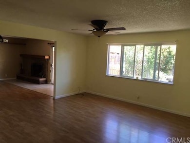 Living room with newer flooring and paint.