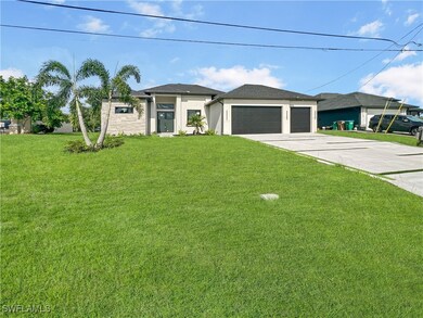 Prairie-style home with driveway, a front lawn, a
