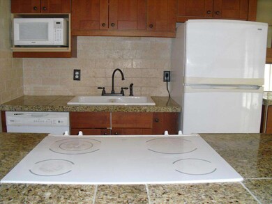 Open kitchen with granite tile counters