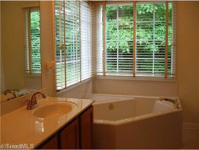 Master Bath/Spa. The Master Bath has lovely corner windows, garden tub and a separate shower.  Notice the new fixtures.