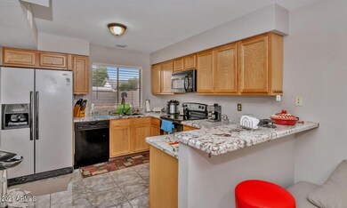 3067 N 89th Ln-large-009-006-3067 N 89th