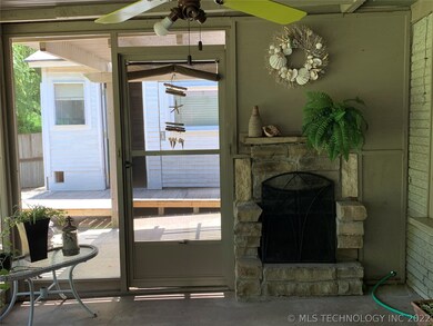 Screened in back porch with Fireplace