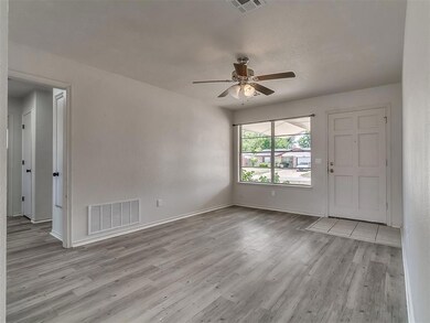 Empty room featuring light hardwood / wood-style f