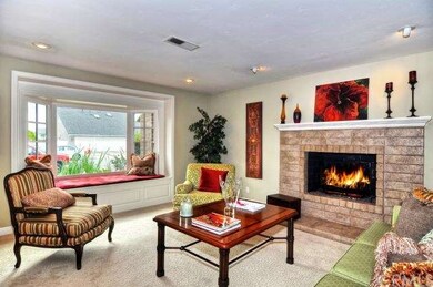 Reverse view of Living Room.  Window seat is perfe