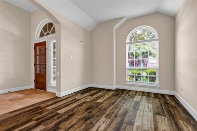 Upon entry, you're greeted by a versatile open room, ideal for use as a home office or study.