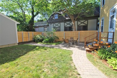Fenced Backyard and patio.  Gate to the garage on