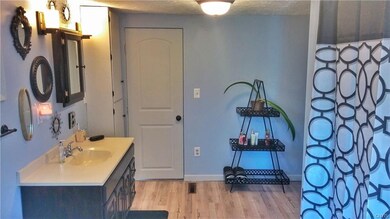 Full Bath and Laundry opens up to the outside deck