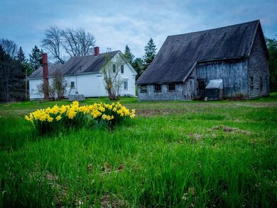 Rear view of house and barn