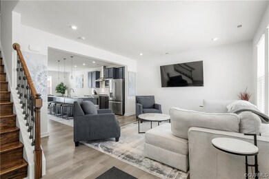 Open layout first floor with family room, kitchen, dining area.