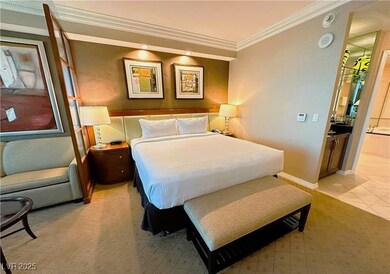 Bedroom featuring crown molding, baseboards, and l