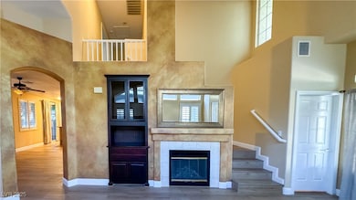 Unfurnished living room featuring a towering ceili