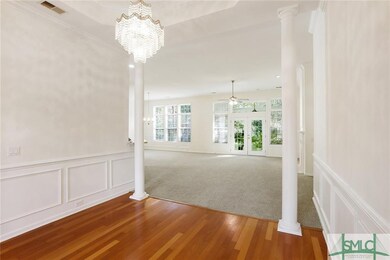 Gorgeous chandelier and columns welcome you into t