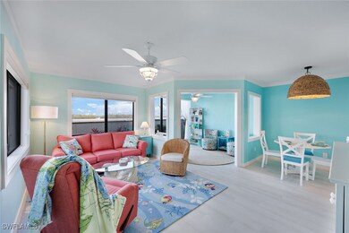Living room featuring ornamental molding and light