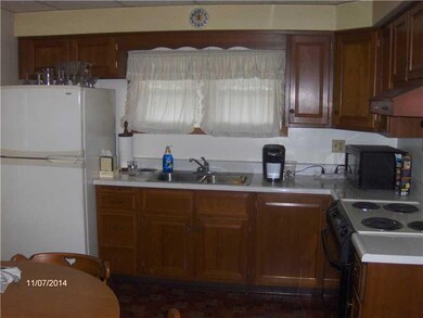 Kitchen. Wood Cabinets are in good condition