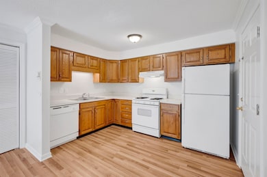 Kitchen with wood cabinets and a functional layout