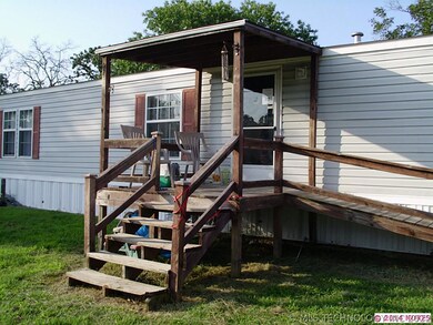 Front porch with wheelchair ramp offers a serene s